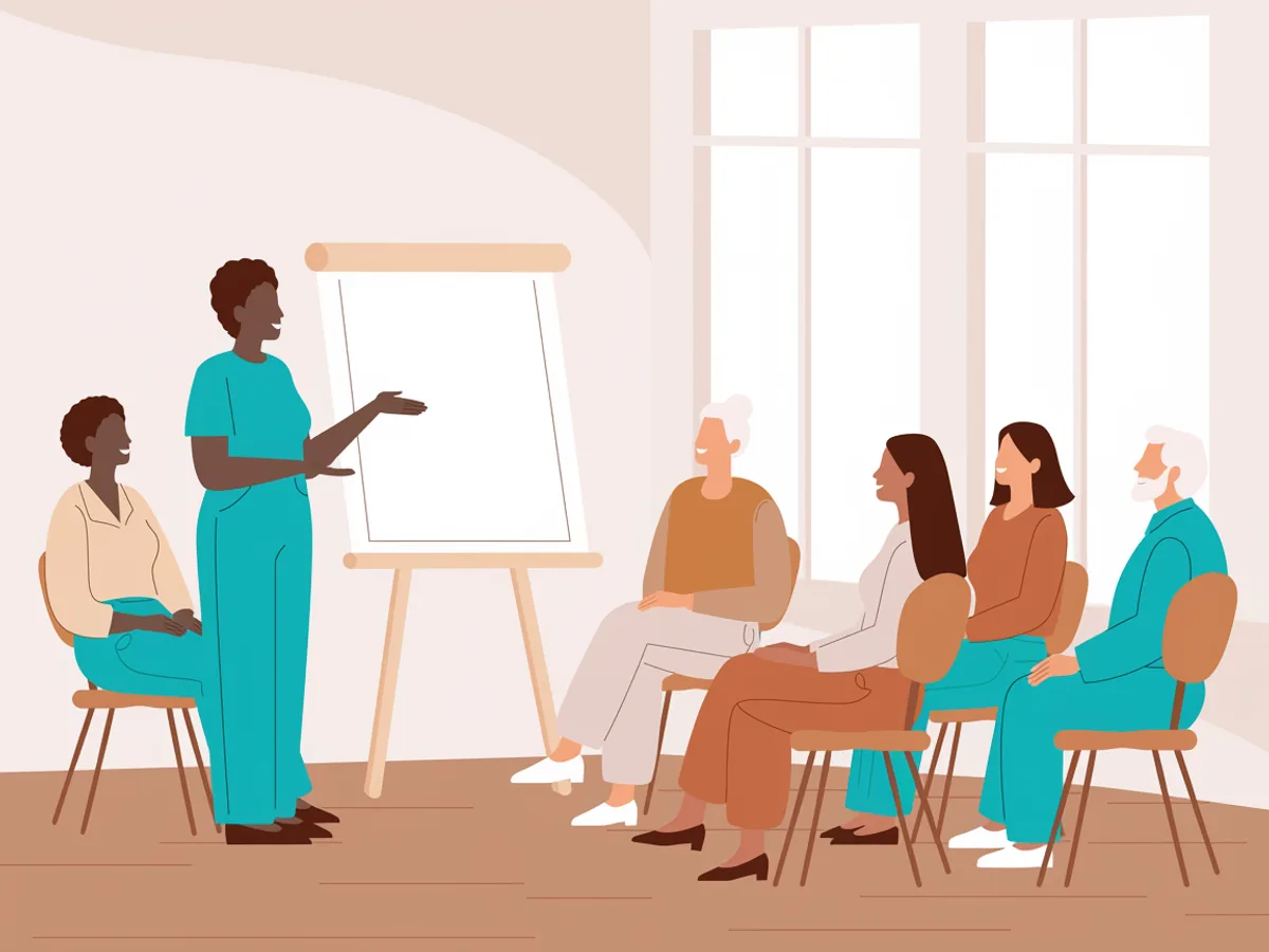 Illustration: Eine stehende Person erklärt etwas an einem Flipchart, ihr gegenüber sitzt eine Gruppe Erwachsener im Halbkreis vor grossen Fenstern.